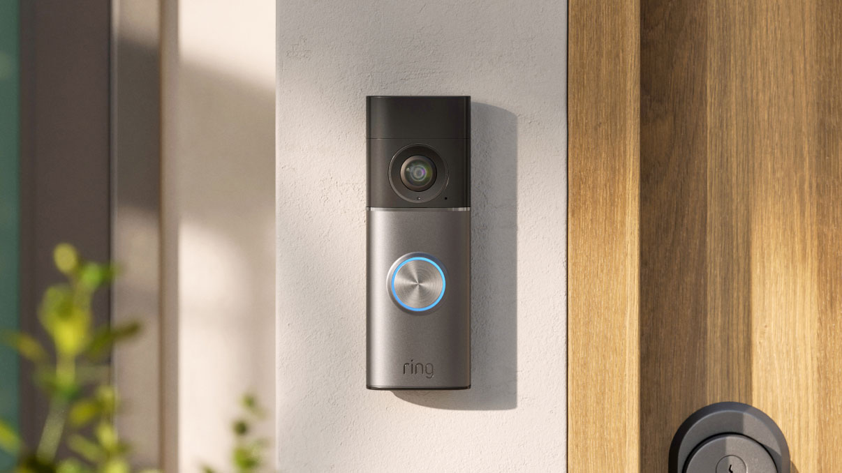 Ring video doorbell mounted beside a front door