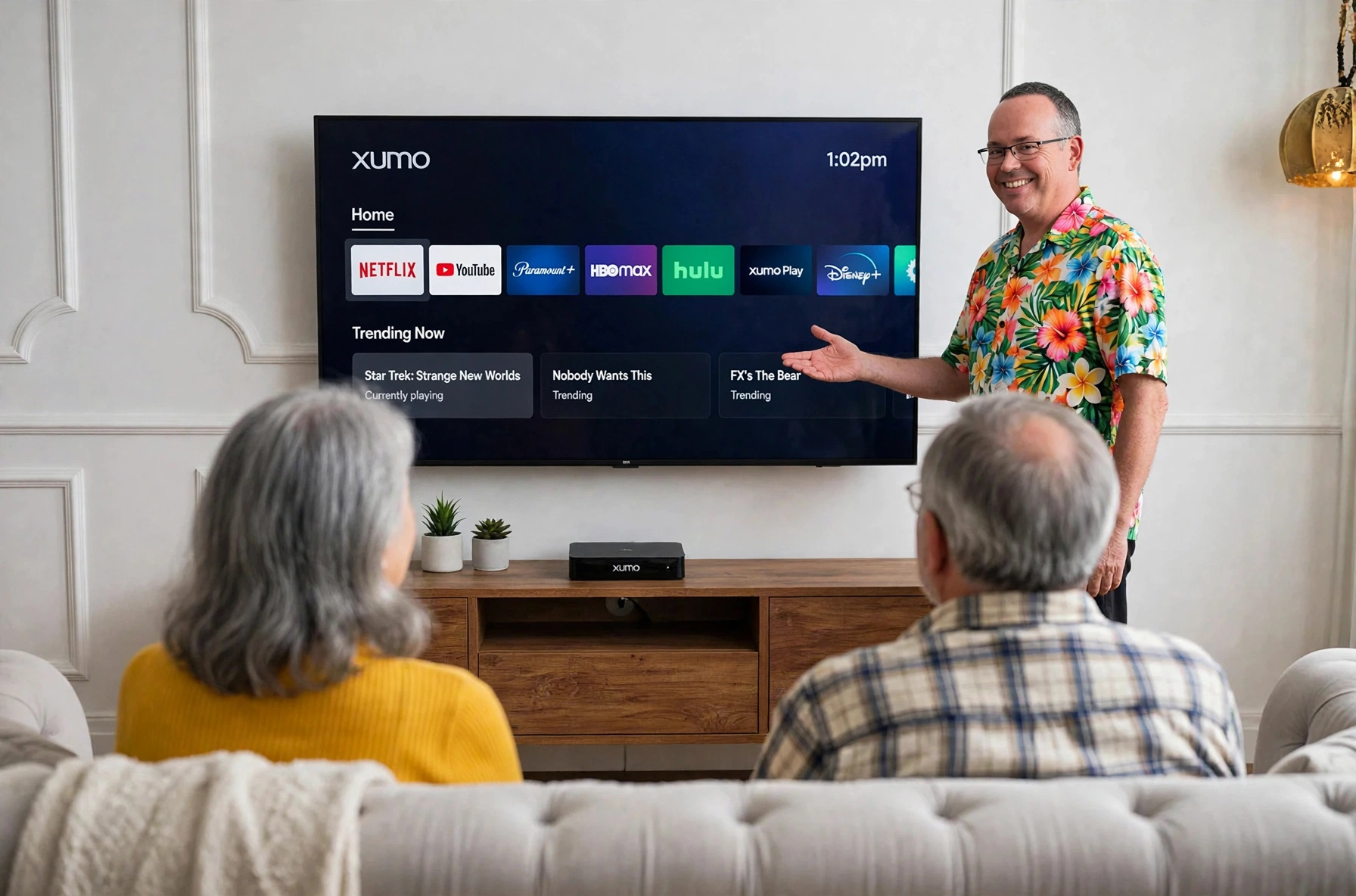 Technician helping seniors with a streaming TV setup showing the home screen