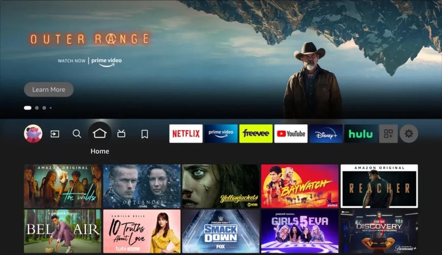 Fire TV home screen: navigation tabs across the top with app icons and show rows